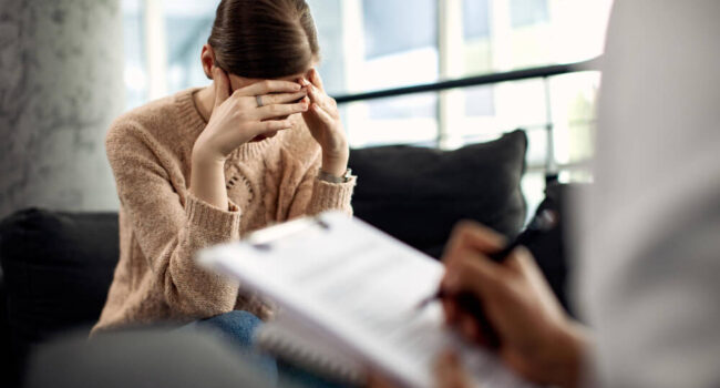 depressed-woman-having-psychotherapy-session-doctor-s-office